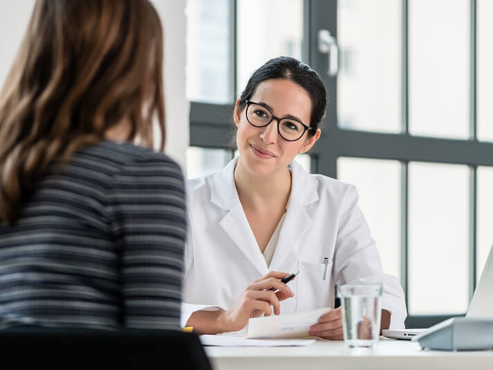 woman talking to insurance agent