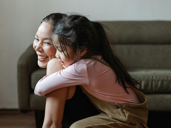 mother and daughter embracing
