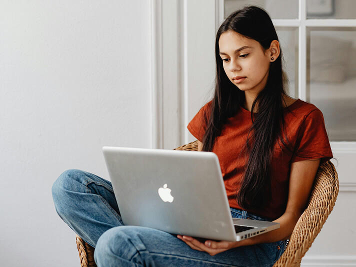 teen on a laptop